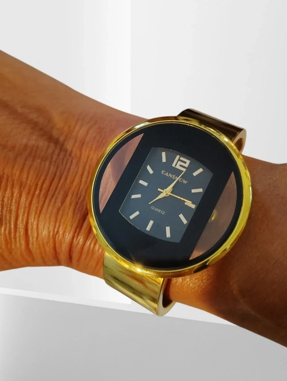Canon Gold and Black Round Face Quartz Watch